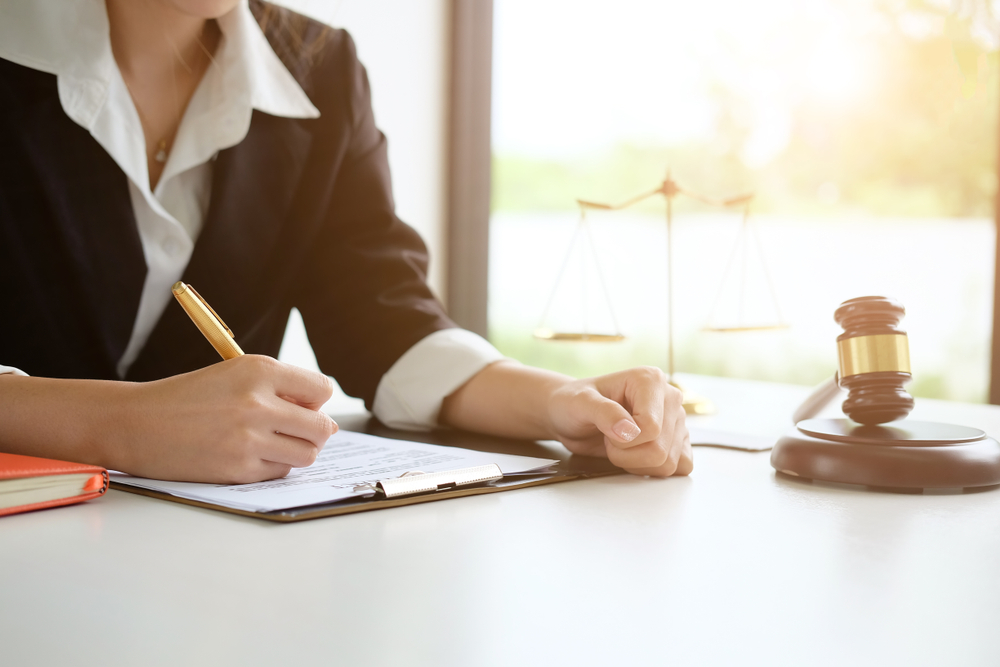 woman with clipboard & gavel