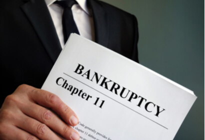 attorney holding chapter 11 bankruptcy paperwork