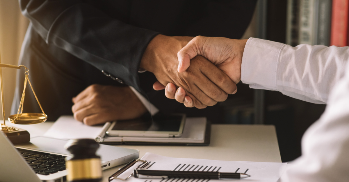 lawyer and client handshake