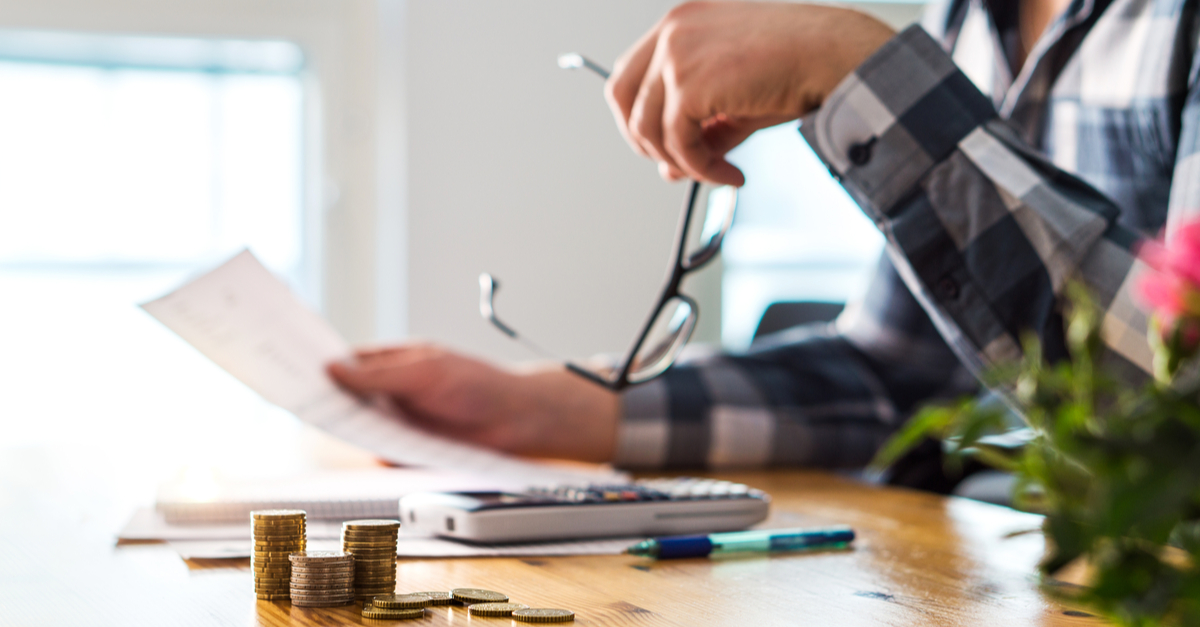 A man reading a foreclosure notice