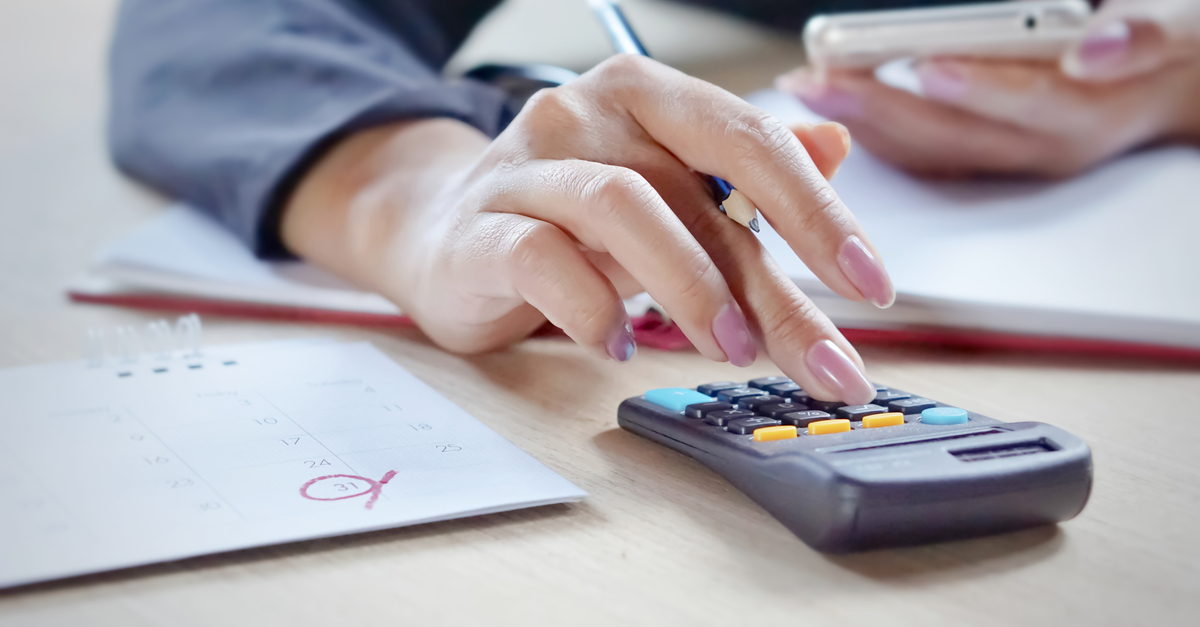 Close view business woman hand calculating