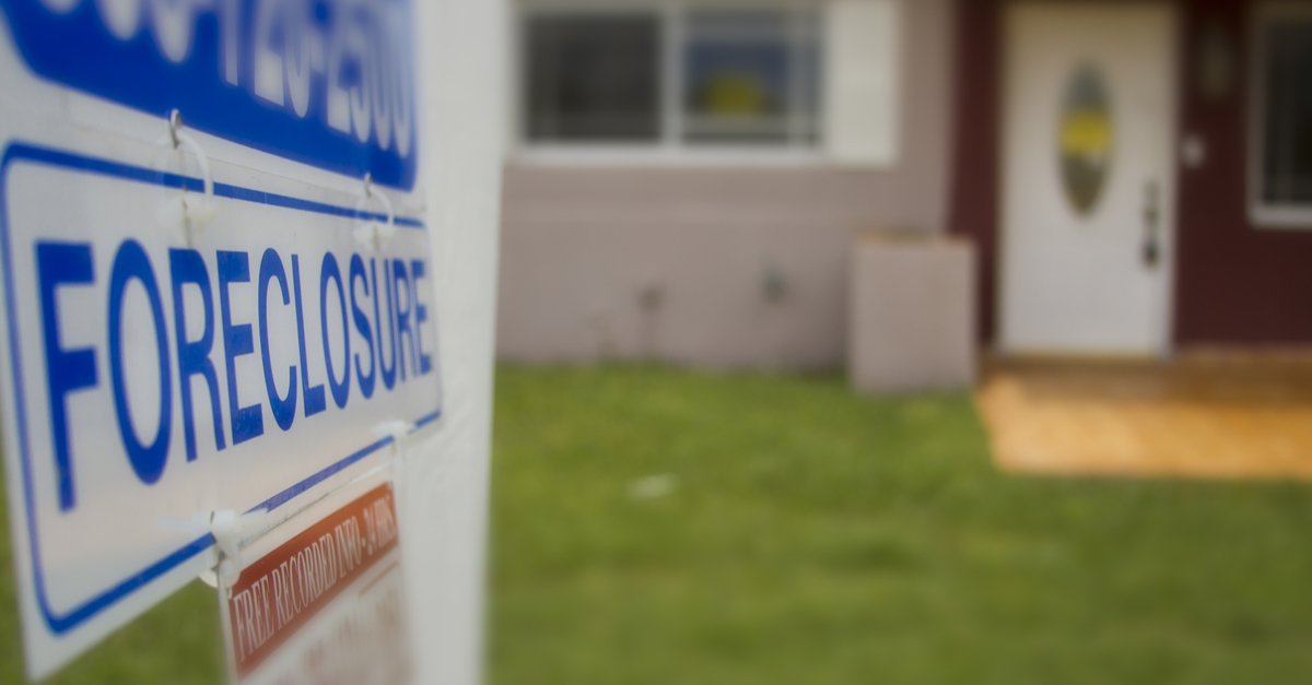 foreclosure sign outside of a house.