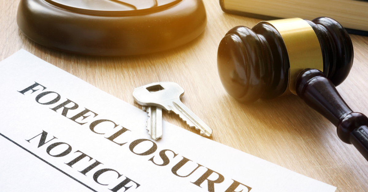 foreclosure notice and keys on court table