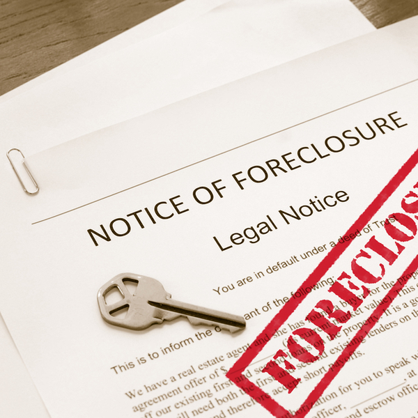 home foreclosure legal document with house key