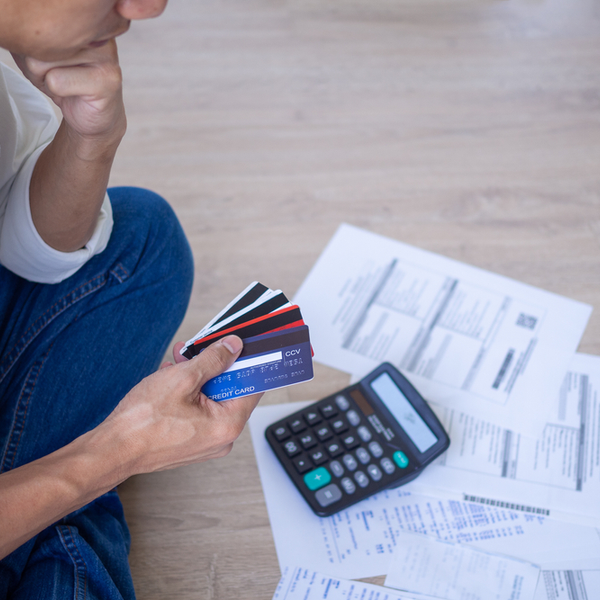 Business men sitting stressed out with home expenses and monthly credit card debt.