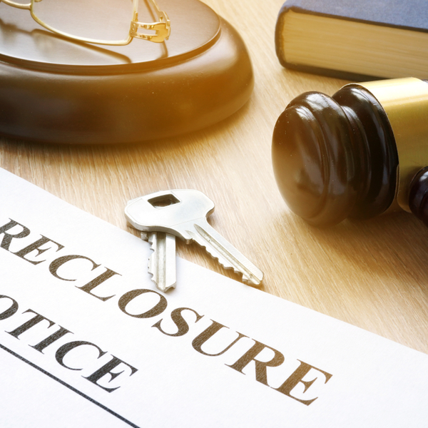 foreclosure notice and keys on court table