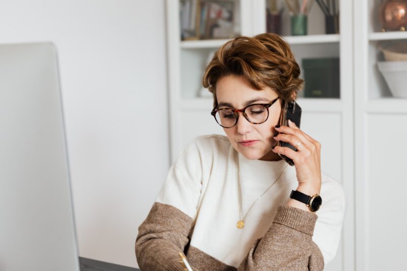 woman on the phone with a debt collector in Florida