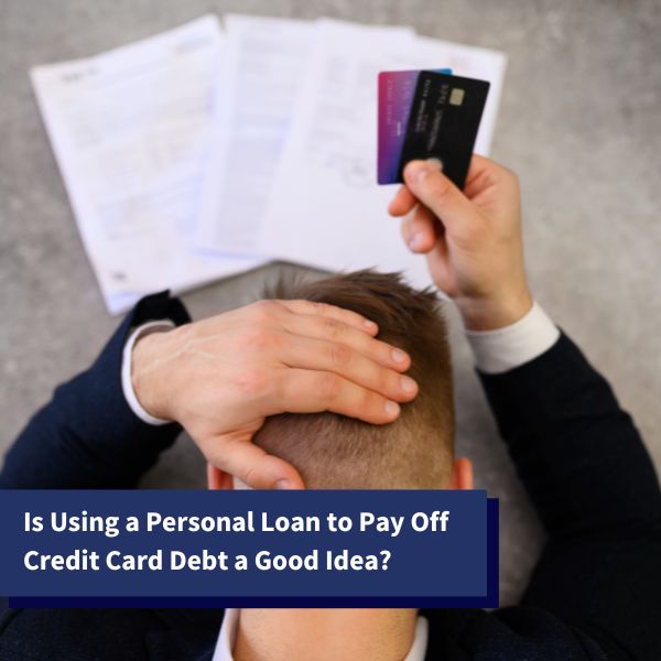 Worried man looking at documents with credit cards in hand