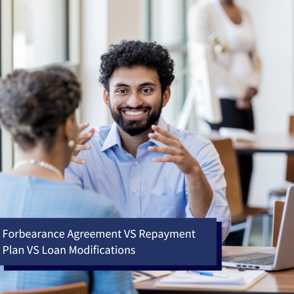 advisor explaining forbearance agreements, repayment plans and loan mods
