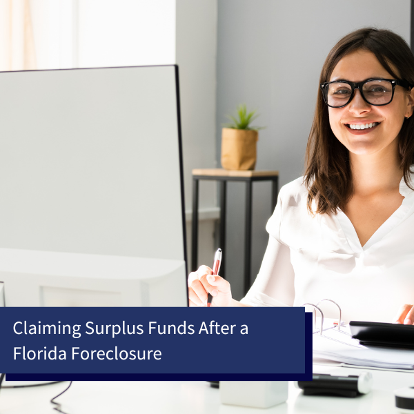 woman in front of her computer looking at bank account after claiming surplus funds after foreclosure