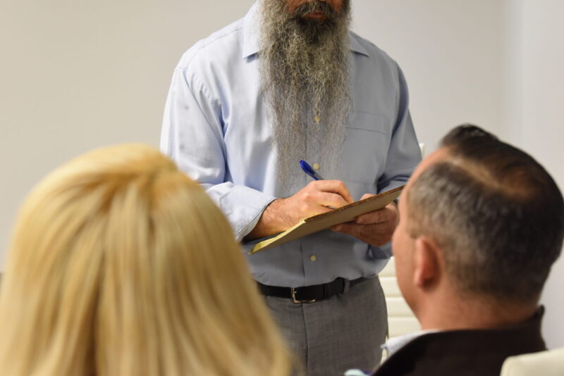 Foreclosure defense attorney at Loan Lawyers planning a strategic foreclosure with clients