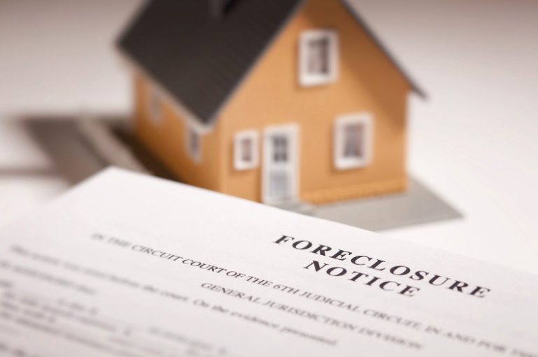 foreclosure notice in front of a house - foreclosure lawyer near Hollywood FL